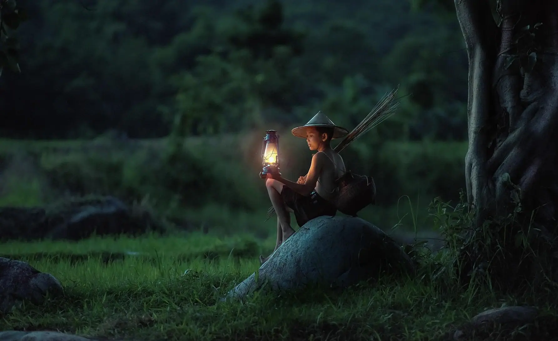 Boy, sitting and lantern